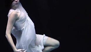 andrejka stuns with incredible underwater moves. her wet body glides effortlessly in the pool.