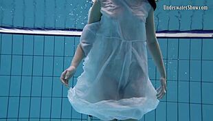 andrejka stuns with incredible underwater moves. her wet body glides effortlessly in the pool.