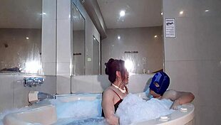 A mature goddess luxuriates in a bath with a young penguin and indulges too much in the hostess's wild foot fetish