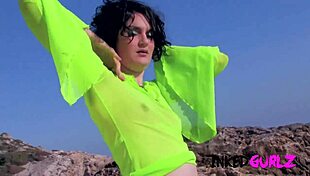 Watch inked brunette get anal on the beach