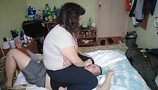 Foot domination with socks and barefoot moves in mixed wrestling humiliation.