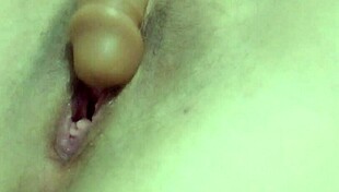 Sexy hot milf on webcam fingers herself using a dildo, teasing her big tits