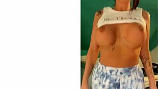 Bending Over A Little For A Closer View Of Big Tits And Tattoo