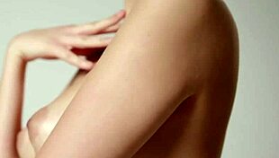 Naturally busty teen teases with her shaved pussy and big tits.