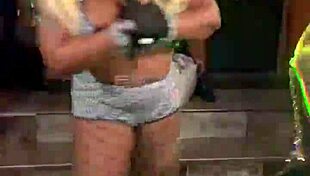 Afrocandy displaying her sizable bosom during a live show