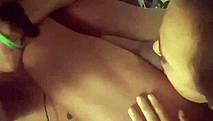 It is a mature woman who is inserting a butt plug in a man's anus while stimulating his balls and playing the anus
