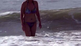 Latina wife relaxes on the beach then masturbates privately for her young lover