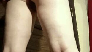 Busty camgirl in grey explores her curves