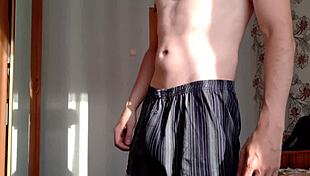 watch this village guy jerk his big cock and cum on belly?