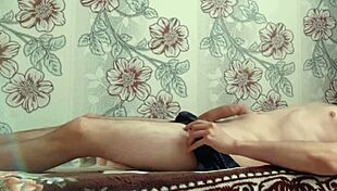 watch this village guy jerk his big cock and cum on belly?