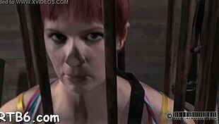 Attractive Playgirl Is Hung Up And Receives Punishment In A Dim Garage Setting