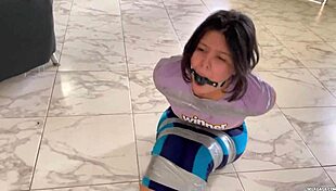 ball gagged girl struggles in barefoot tape bondage contest