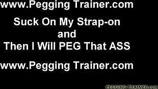 The girl bends over for strapon fucking with toys.