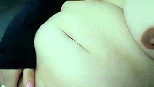 Masturbation session heats up in a car during a daring public moment.