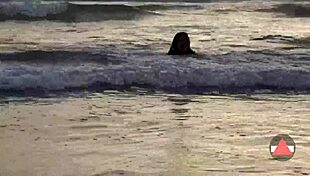 Asian model enjoys messy beach day in wet bikini