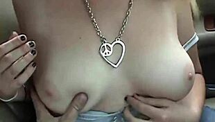 Blonde couple's naughty car blowjob.