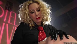 blonde milf femdom takes control, fucks bound gimp in bizarre scene.