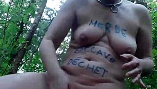 slave girl masturbates outdoors in forest bdsm