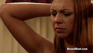 lesbian slave stands still waiting for ass whipping in femdom bondage