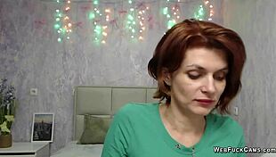 Beautiful redhead ginger shows off her ass in leather pants on webcam