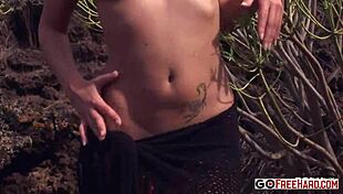 Katy's ass pushes out in outdoor solo tease, feeling the thrill.