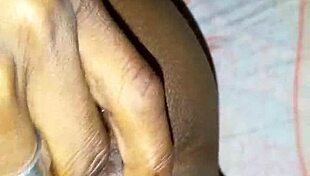 On vacation, she got horny and started fingering herself alone on the bed