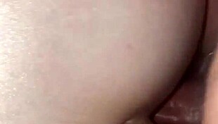 husband enjoys intimate moment with wife