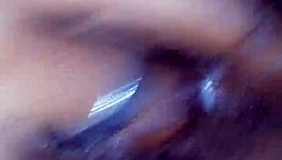 On vacation, she got horny and started fingering herself alone on the bed