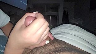 This big black cock gets an amazing handjob