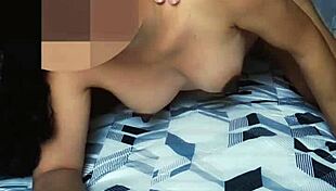 Ebony woman enjoys intimate moment on bed