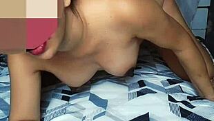 Ebony woman enjoys intimate moment on bed