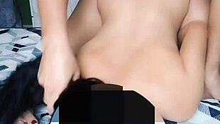 Ebony woman enjoys intimate moment on bed