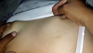 Mother-in-Law Caresses Tits While Relaxed on Bed Watching TV