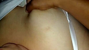 Mother-in-Law Caresses Tits While Relaxed on Bed Watching TV