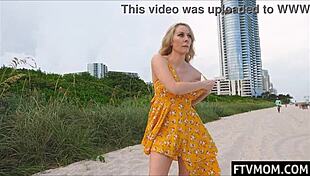I can't believe I'm flashing my tits on the beach like this!