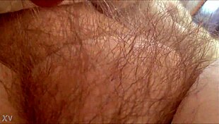 rubbing her hairy milf pussy at home 😈