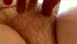 rubbing her hairy milf pussy at home 😈
