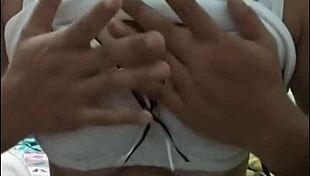 Girl with big tits performs on webcam show.