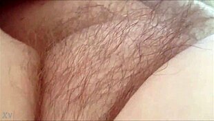 rubbing her hairy milf pussy at home 😈