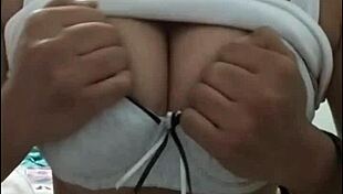 Girl with big tits performs on webcam show.