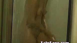 Watch me spy on LelU Love bathing in the shower, zooming in close