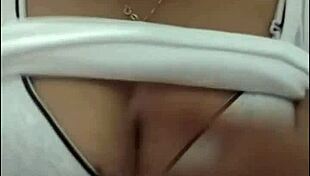 Girl with big tits performs on webcam show.