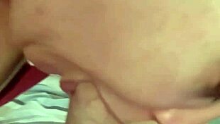 a young woman performs a blowjob on a big cock in this video