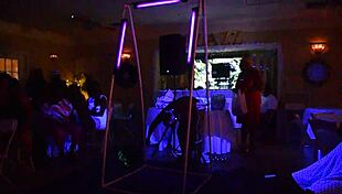 glowing male stripper performs for mature women