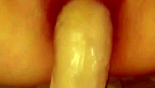 she fingers her wet pussy as i fill her with a gigantic dildo