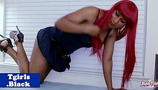 hey, check out this redheaded black tgirl jerking off with toys 😏