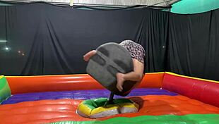 Naughty latina rides mechanical bull, then gets peed on outdoors