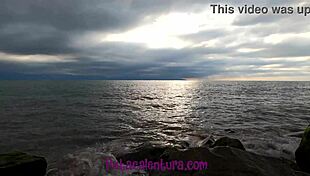 A petite babe gives a blowjob and gets pissed on at the beach