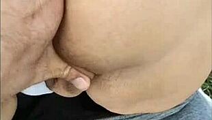 i masturbate in the field, touching my ass and pussy