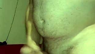 Bound handjob causes massive erection.